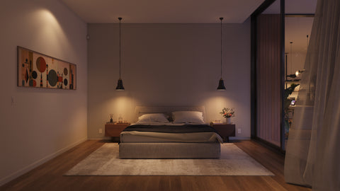 A cozy bedroom in the evening with warm, soft lighting.
